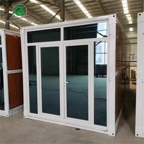 Προσαρμοσμένο Prefab Διπλώσιμο Κουτί Σπίτι Χάλυβα Γυάλινη πόρτα Καφέ τοίχος Διαθέσιμο για ενοικίαση